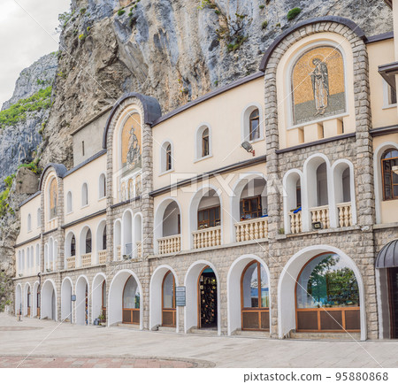 Monastery of Ostrog, Serbian Orthodox Church situated against a vertical background, high up in the large rock of Ostroska Greda, Montenegro. Dedicated to Saint Basil of Ostrog Monastery of Ostrog, Serbian Orthodox Church situated against a vertical background, high up in the large rock of Ostroska Greda, Montenegro. Dedicated to Saint Basil of Ostrog 95880868