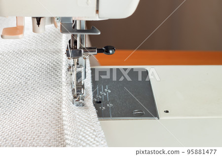 Modern sewing machine and decorative edging cord. 95881477