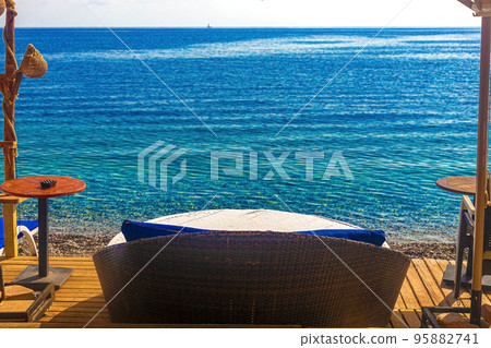 View of the cafe area on the beach. Kemer, Turkey View of the cafe area on the beach. Kemer, Turkey 95882741