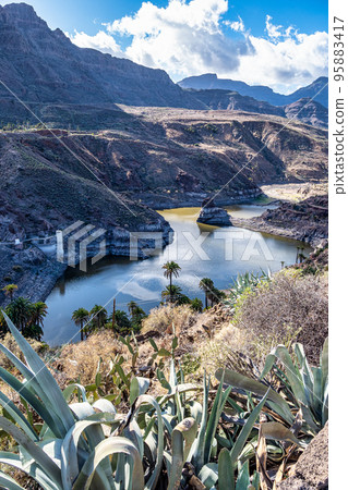 Mountain range at La Sorrueda dam and La Fortaleza de Ansite in Gran Canaria, Canary Islands, Spain Mountain range at La Sorrueda dam and La Fortaleza de Ansite in Gran Canaria, Canary Islands, Spain 95883417