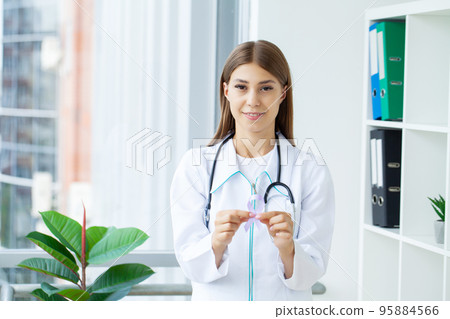 Womans hands holding purple domestic violence awareness ribbon 95884566