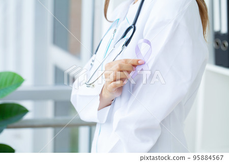Woman holding purple ribbon, domestic violence awareness Woman holding purple ribbon, domestic violence awareness 95884567