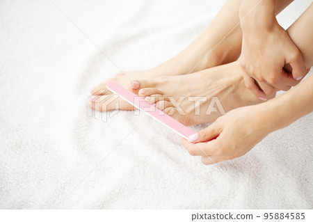 Close up of female that going pedicure at home 95884585