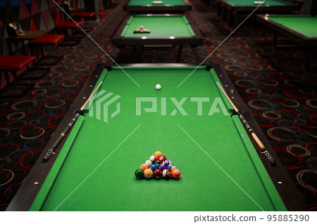 Billiard table with green surface and ball 95885290