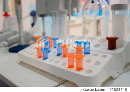 Medical plastic vials in showcase at pharmaceutical exhibition Medical plastic vials in showcase at pharmaceutical exhibition 95885746