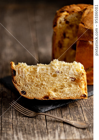Panettone Christmas Cake. Italian sweet bread on wooden table. 95886081