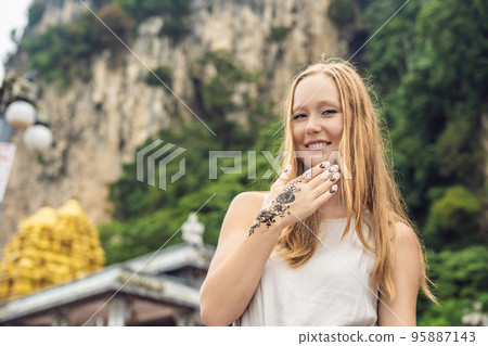 Woman with mahendi. Hand decorated with henna Tattoo. mehendi hand 95887143