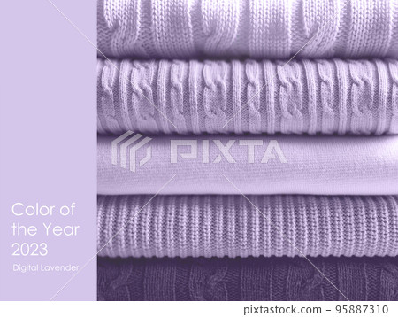Pile of wool sweaters in trendy colour of the year 2023 digital lavende 95887310
