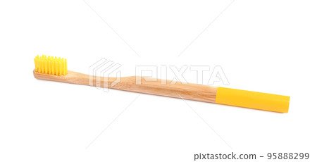 Bamboo toothbrush with yellow bristle isolated on white Bamboo toothbrush with yellow bristle isolated on white 95888299
