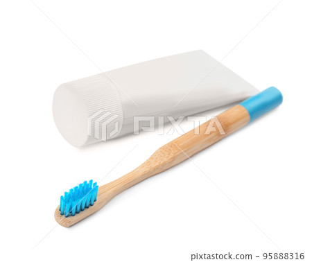 Bamboo toothbrush and paste isolated on white Bamboo toothbrush and paste isolated on white 95888316
