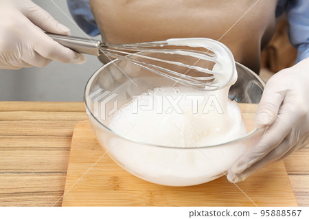 Woman making natural handmade soap at wooden table, closeup Woman making natural handmade soap at wooden table, closeup 95888567