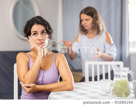 Young female LGBT couple arguing at home Young female LGBT couple arguing at home 95890199