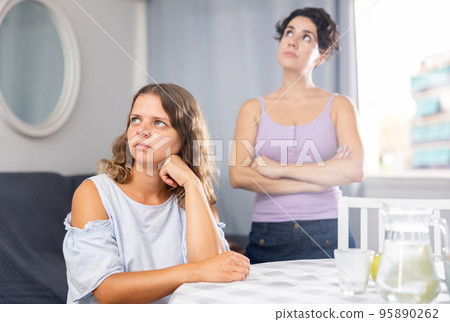 Offended girlfriends ignoring each other after quarrel 95890262