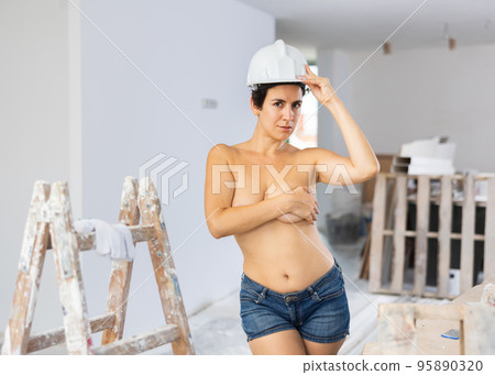 Sensual glamour sexy girl builder covering breast with hand Sensual glamour sexy girl builder covering breast with hand 95890320