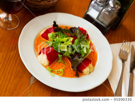 Tasty stuffed piquillo peppers with cod brandade in sauce Tasty stuffed piquillo peppers with cod brandade in sauce 95890330