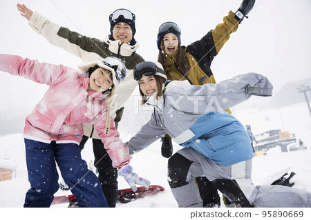 Parents and children and instructors who enjoy snowboarding even in the snow Snowboard school 95890669