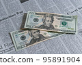 English newspaper and $20 bill 95891904