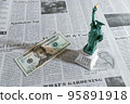 English newspaper and $20 bill 95891918