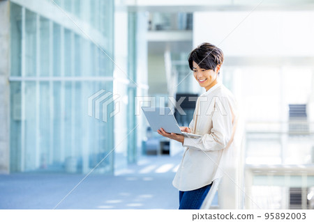 Young man with a laptop Young man with a laptop 95892003