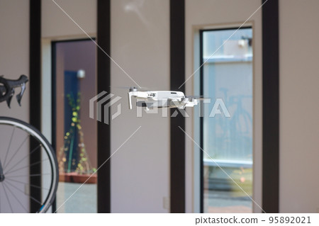 Image of a small drone flying indoors Image of a small drone flying indoors 95892021