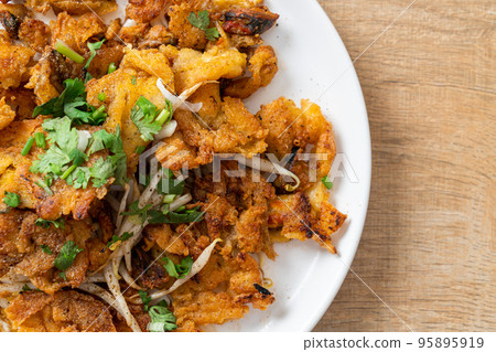 Crispy fried mussel pancake with egg Crispy fried mussel pancake with egg 95895919