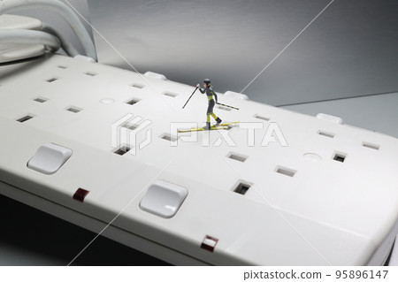 a mini skier on socket, winter sports. 95896147