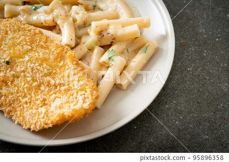 quadrotto penne pasta white cream sauce with fried fish 95896358