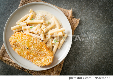 quadrotto penne pasta white cream sauce with fried fish 95896362