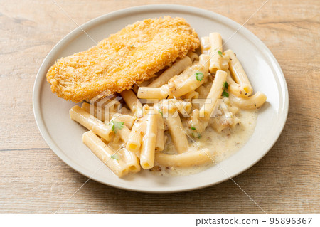 quadrotto penne pasta white cream sauce with fried fish 95896367