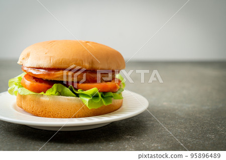 chicken burger with sauce on plate chicken burger with sauce on plate 95896489