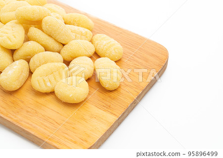 Traditional Italian gnocchi pasta uncooked on white background Traditional Italian gnocchi pasta uncooked on white background 95896499