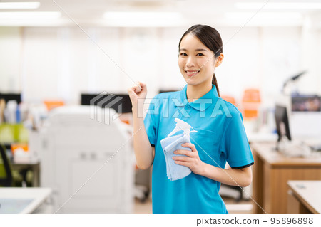 Young female cleaning staff (guts pose) 95896898