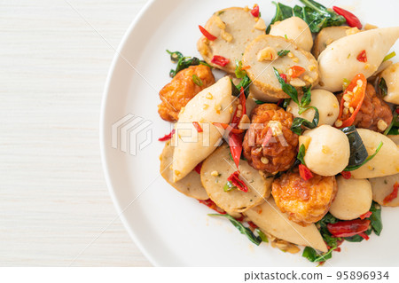 Spicy stir fried fish balls 95896934