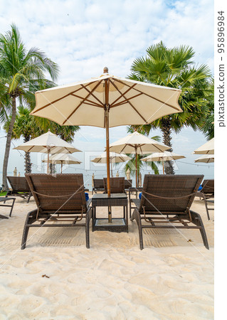 beach chair with palm tree on beach beach chair with palm tree on beach 95896984