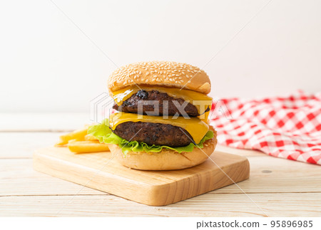 hamburger or beef burgers with cheese and french fries hamburger or beef burgers with cheese and french fries 95896985