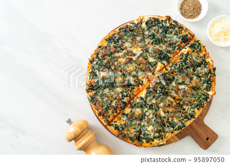 spinach and cheese pizza on wood tray spinach and cheese pizza on wood tray 95897050