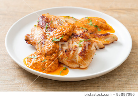 grilled chicken steak with red curry sauce grilled chicken steak with red curry sauce 95897096