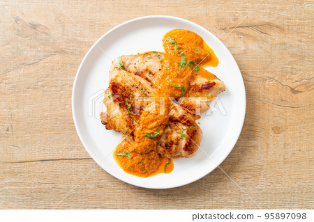 grilled chicken steak with red curry sauce grilled chicken steak with red curry sauce 95897098