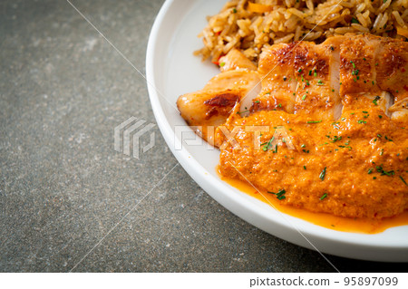 grilled chicken steak with red curry sauce and rice 95897099
