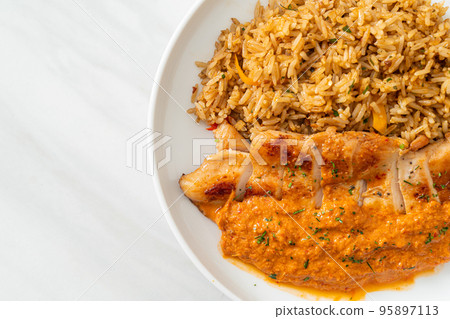 grilled chicken steak with red curry sauce and rice grilled chicken steak with red curry sauce and rice 95897113