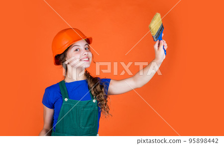 teen girl painter in protective helmet use painting brush, creativity teen girl painter in protective helmet use painting brush, creativity 95898442