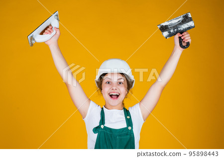 After the work is done. kid bricklayer masonry worker with helmet and putty knife. house renovation. happy girl working with spatula. small builder using putty knife. kid with helmet holding spatula After the work is done. kid bricklayer masonry worker with helmet and putty knife. house renovation. happy girl working with spatula. small builder using putty knife. kid with helmet holding spatula 95898443