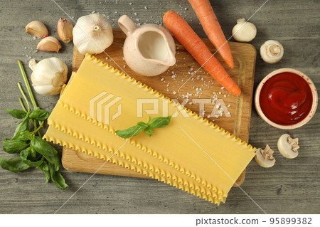 Concept of cooking tasty lasagna, top view 95899382