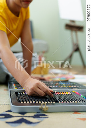 Portrait of an Asian woman designing art in her spare time Portrait of an Asian woman designing art in her spare time 95900272