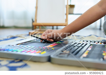 Portrait of an Asian woman designing art in her spare time Portrait of an Asian woman designing art in her spare time 95900421