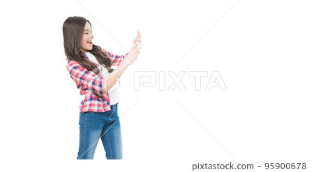 happy teen child taking picture on phone camera isolated on white background with copy space 95900678