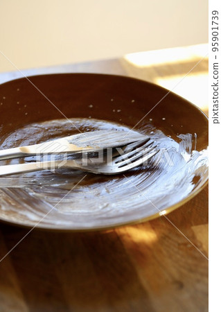 Dirty plates, forks and knives after eating 95901739