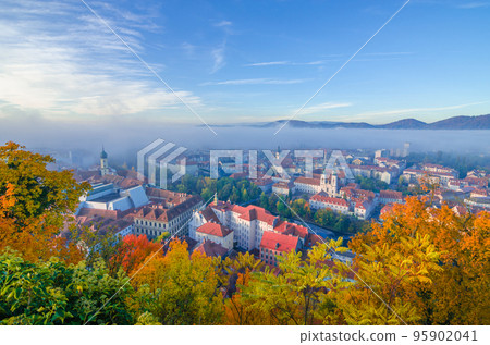 Cityscape of Graz with Mur river and Mariahilfer church (Mariahilferkirche), view from the Shlossberg hill, in Graz, Styria region, Austria Cityscape of Graz with Mur river and Mariahilfer church (Mariahilferkirche), view from the Shlossberg hill, in Graz, Styria region, Austria 95902041