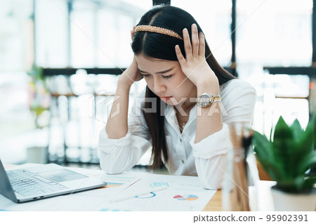 Portrait of sme business owner, woman using computer and financial statements Anxious expression on expanding the market to increase the ability to invest in business. Portrait of sme business owner, woman using computer and financial statements Anxious expression on expanding the market to increase the ability to invest in business. 95902391