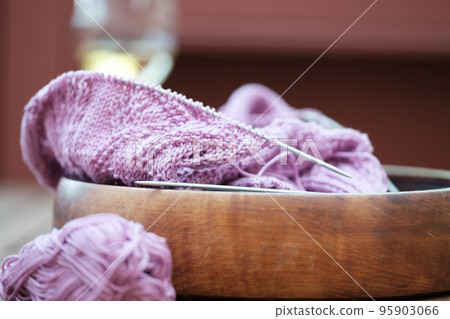 Female hobby knitting. Knitting project in progress Female hobby knitting. Knitting project in progress 95903066